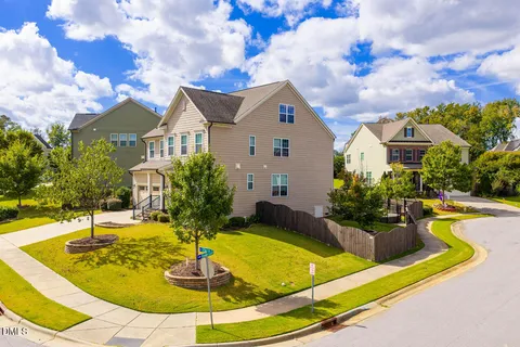 an aerial view of a house with a swimming pool
