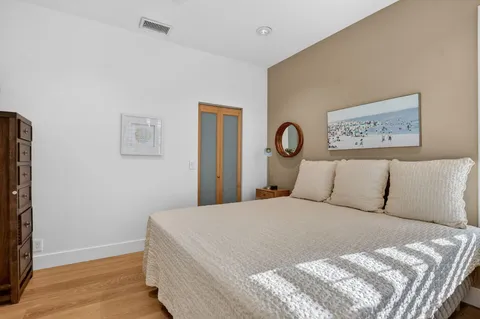 a bathroom with a double vanity sink toilet and shower