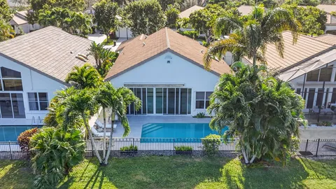 a dining room with furniture a flat screen tv and a large window