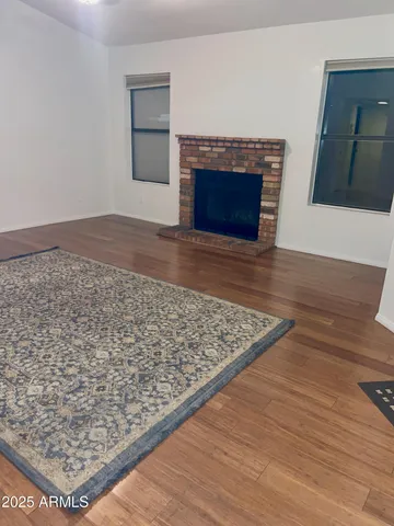 a view of a room with wooden floor