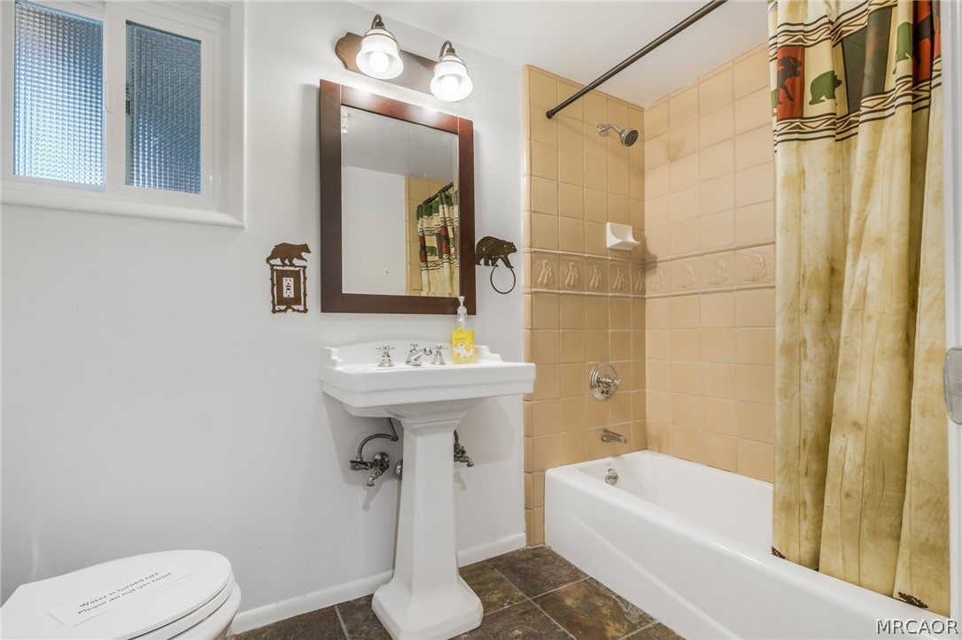 195 Elgin Road Big Bear Lake, CA 92315 - Photo 23 of 45 a bathroom with a sink a toilet and shower