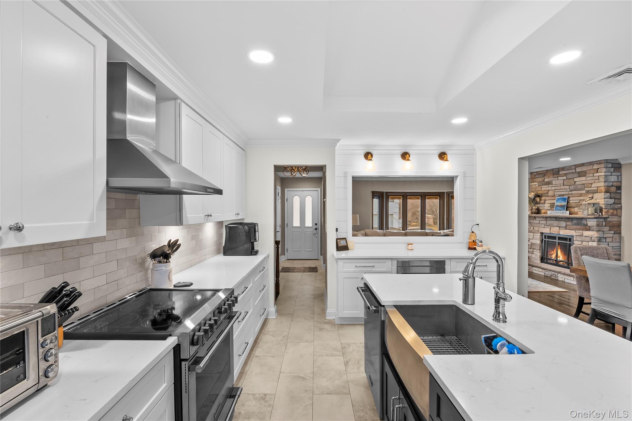 26 Glenwood Road Plainview, NY 11803 - Photo 14 of 42 a kitchen with stainless steel appliances a stove a sink a oven a counter top space and cabinets
