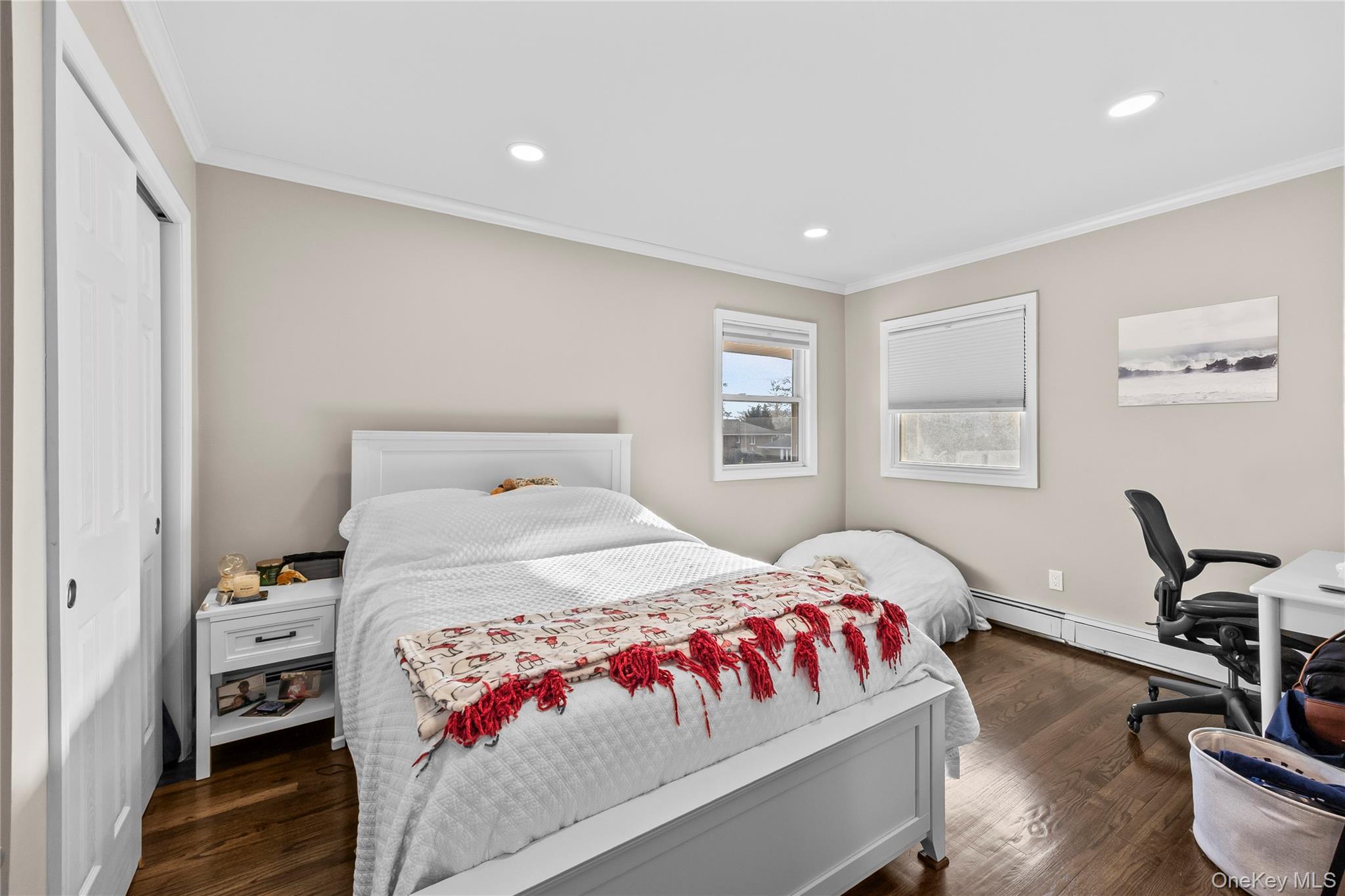 26 Glenwood Road Plainview, NY 11803 - Photo 17 of 42 a bedroom with a bed and wooden floor