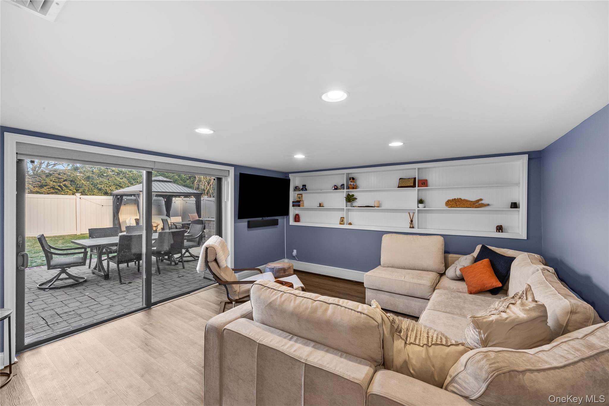 26 Glenwood Road Plainview, NY 11803 - Photo 20 of 42 a living room with furniture and a large window