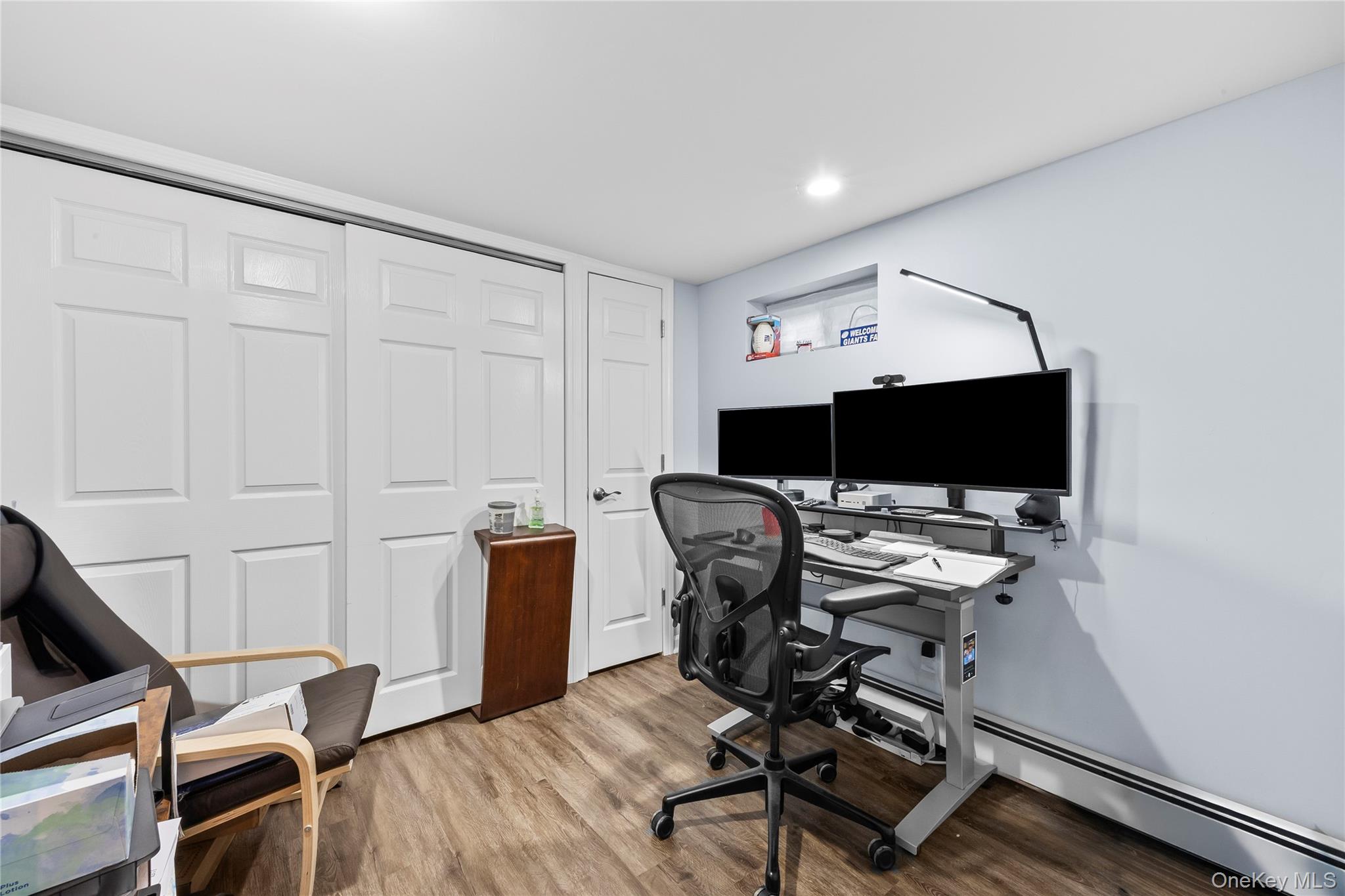 26 Glenwood Road Plainview, NY 11803 - Photo 25 of 42 a view of a workspace with furniture and a flat screen tv