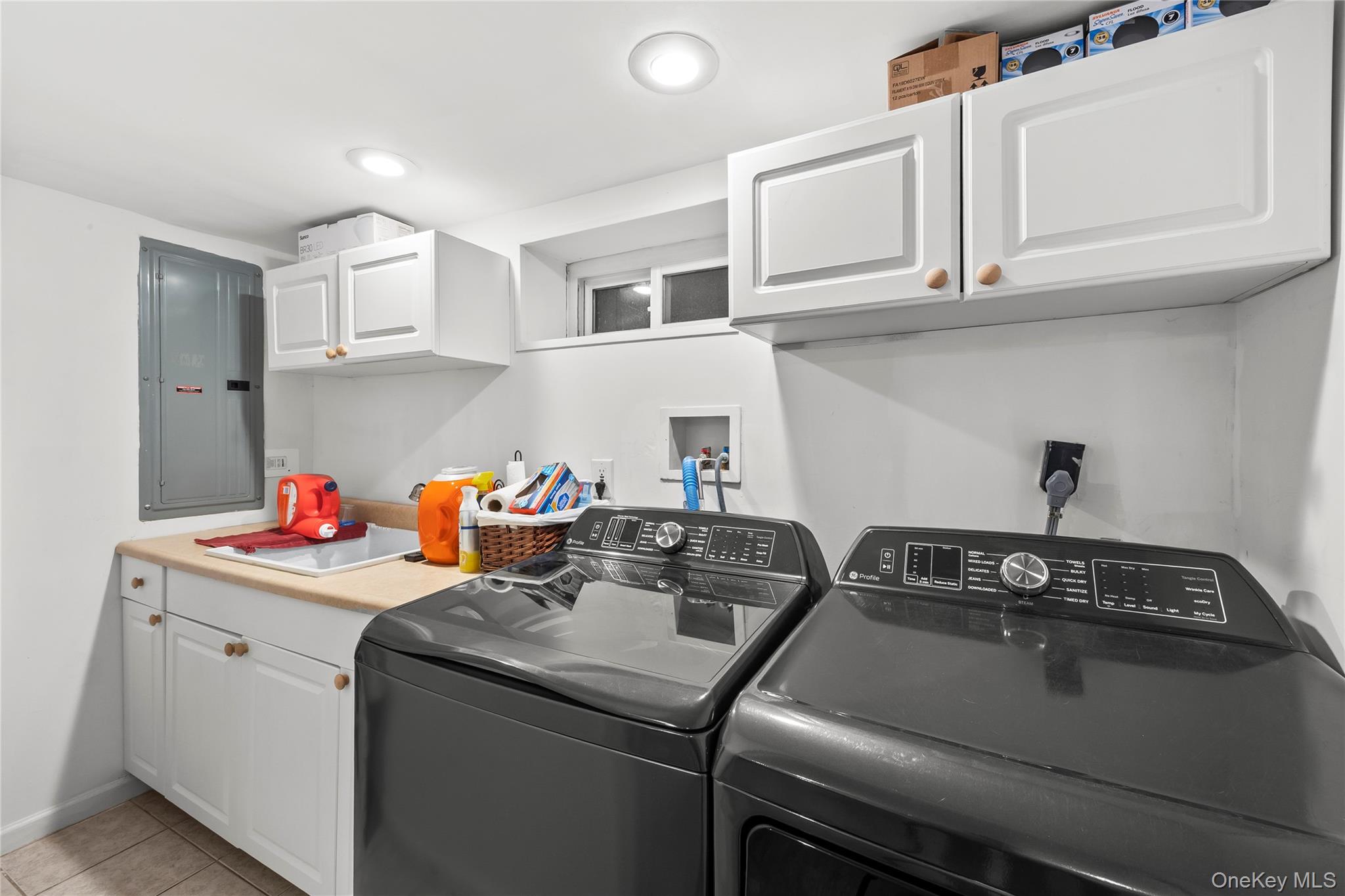26 Glenwood Road Plainview, NY 11803 - Photo 26 of 42 a utility room with dryer and washer