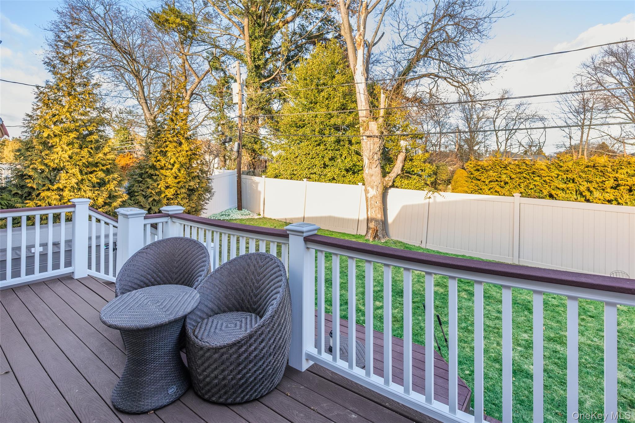 26 Glenwood Road Plainview, NY 11803 - Photo 29 of 42 a view of a porch with furniture and wooden fence