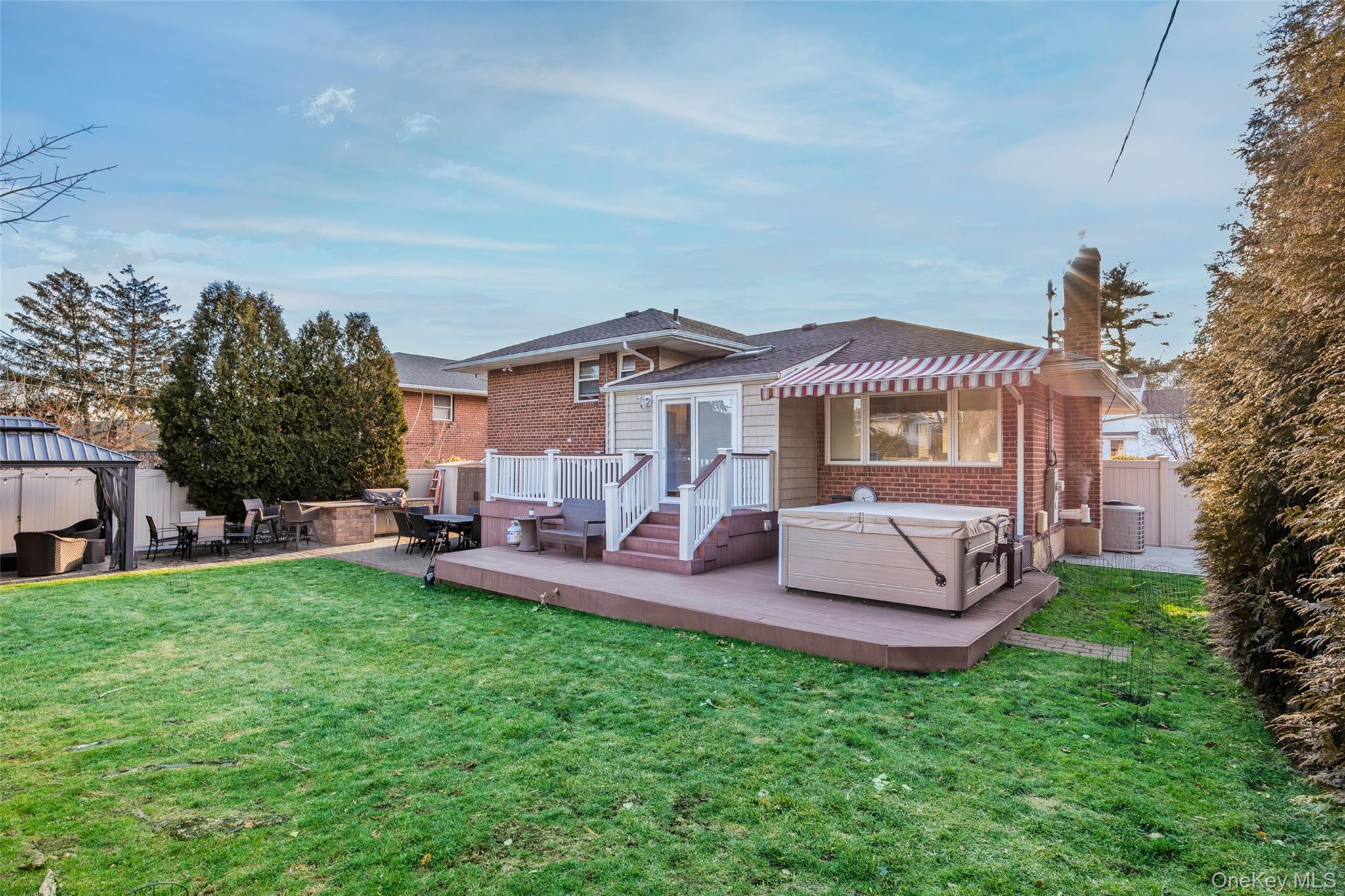 26 Glenwood Road Plainview, NY 11803 - Photo 38 of 42 a view of a house with a yard and sitting area
