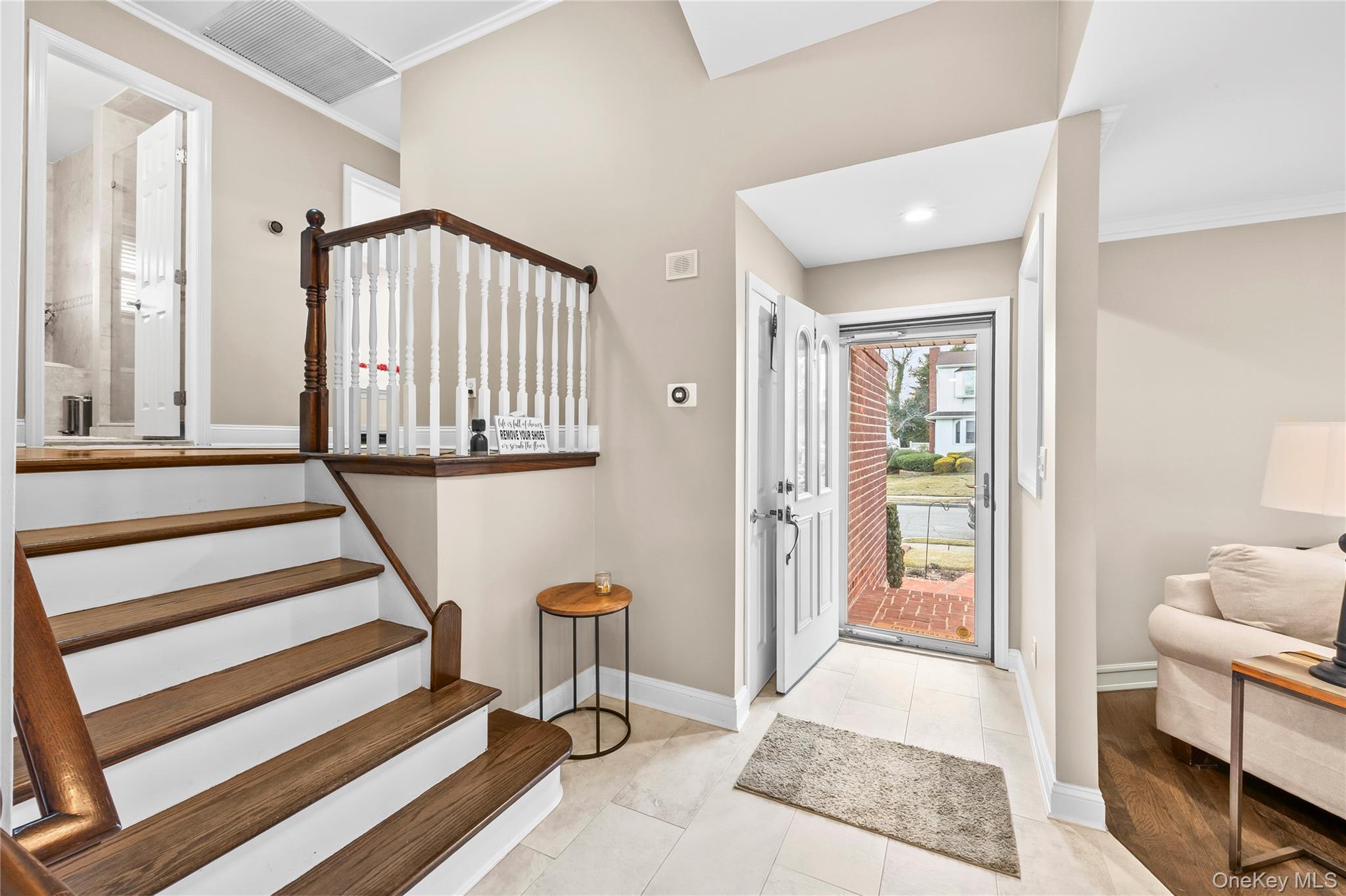 26 Glenwood Road Plainview, NY 11803 - Photo 5 of 42 a view of a hallway with a livingroom and stairs