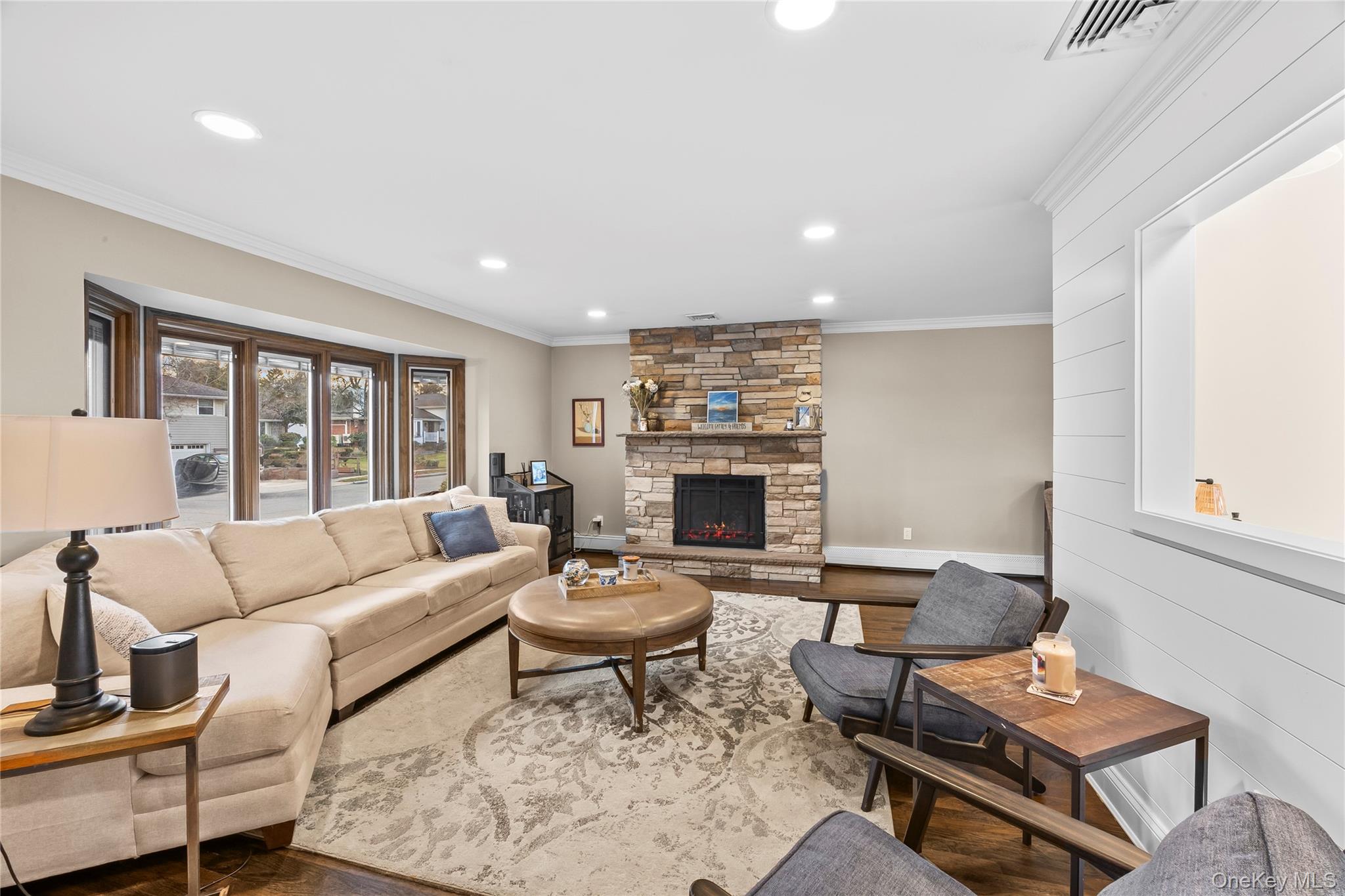 26 Glenwood Road Plainview, NY 11803 - Photo 8 of 42 a living room with furniture and a fireplace
