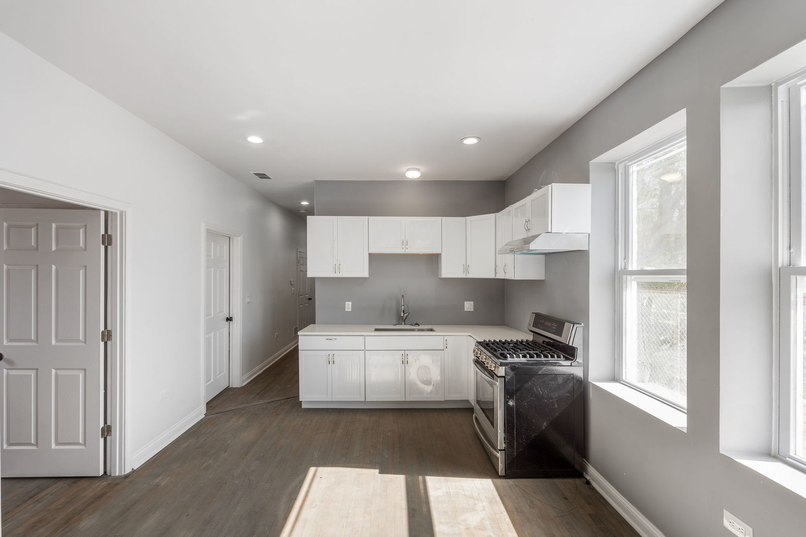 2408 South Trumbull Avenue Chicago, IL 60623 - Photo 15 of 34 a large white kitchen with a large window