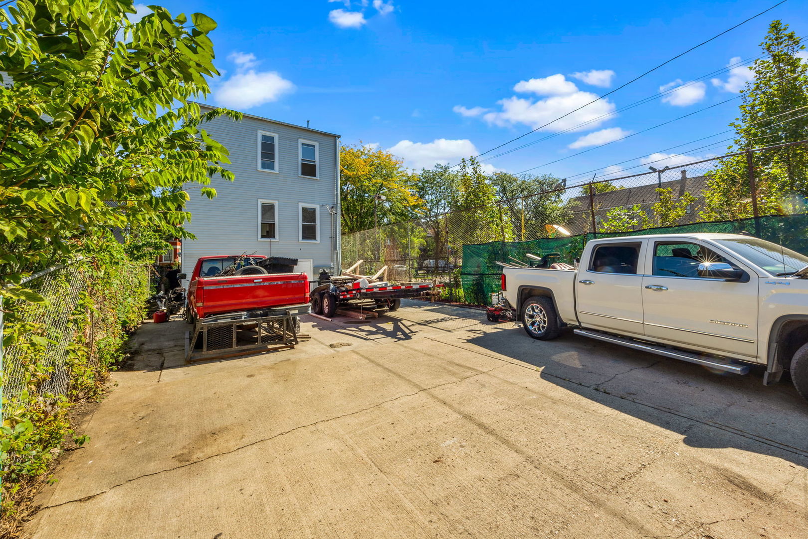 2408 South Trumbull Avenue Chicago, IL 60623 - Photo 30 of 34 a view of a cars park in front of a house