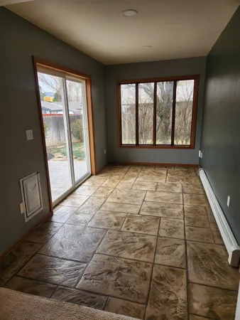 a view of an empty room and window