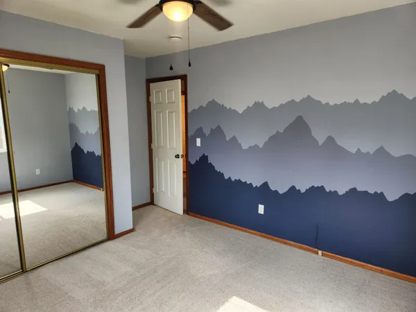 a view of a big room with mountain view
