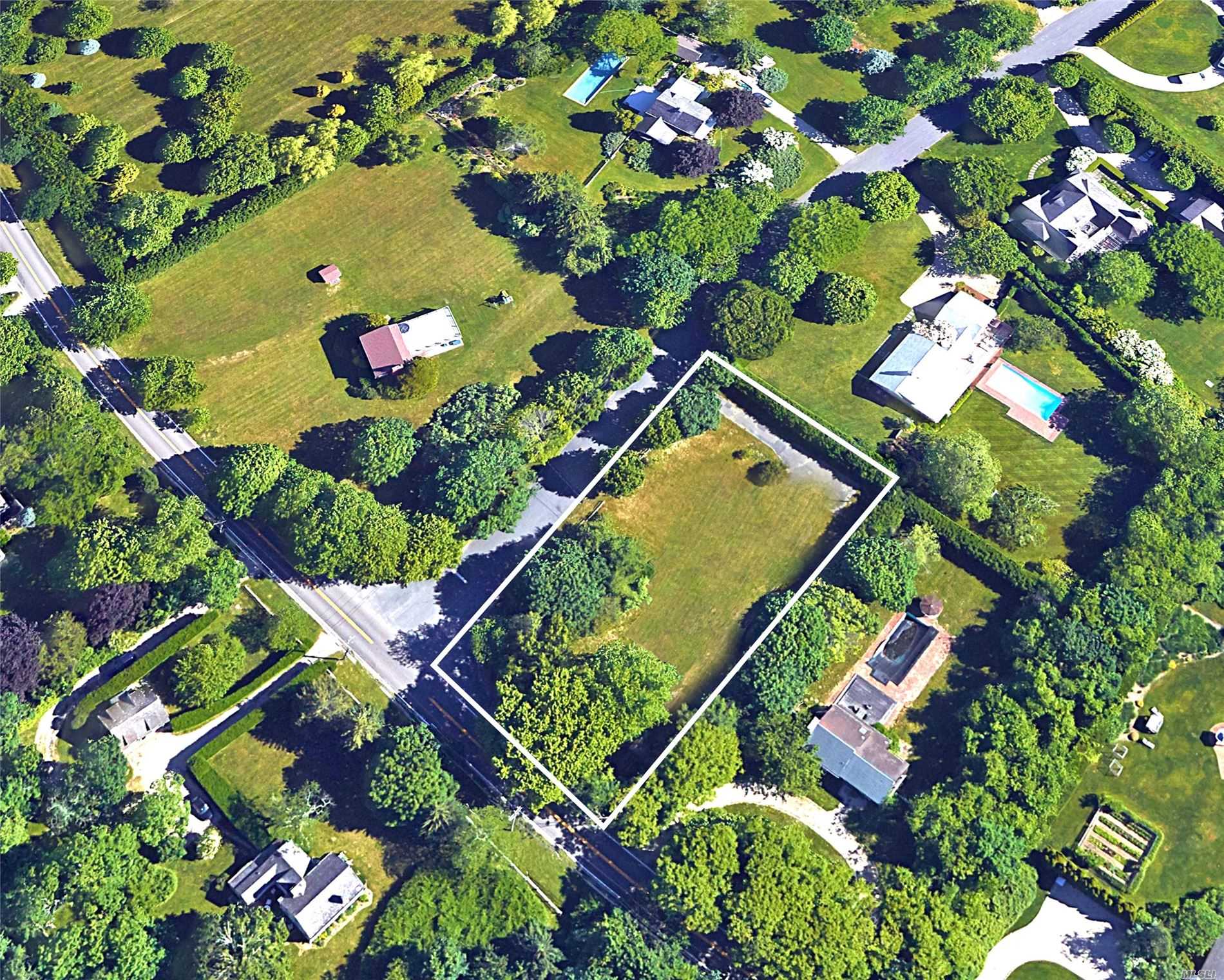 an aerial view of a residential houses with street view