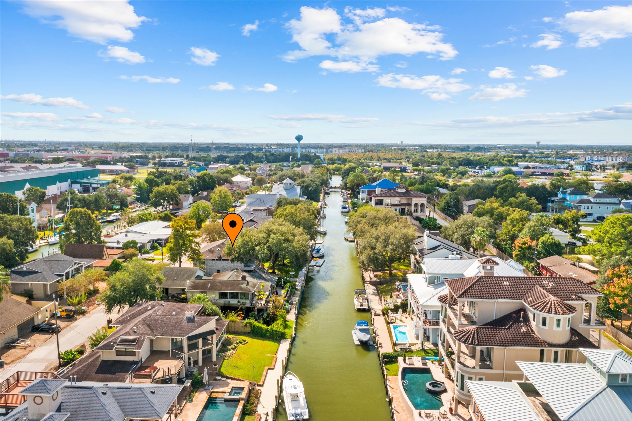 67 Harbor Lane Kemah, TX 77565 - Photo 3 of 47 Experience luxurious waterfront living in this serene canal front neighborhood of Lazy Bend. Spacious homes nestled in lush greenery offer a tranquil, upscale lifestyle perfect for boating enthusiasts, with convenient waterway access and deeded, deep water bulkheads for parking your boats.