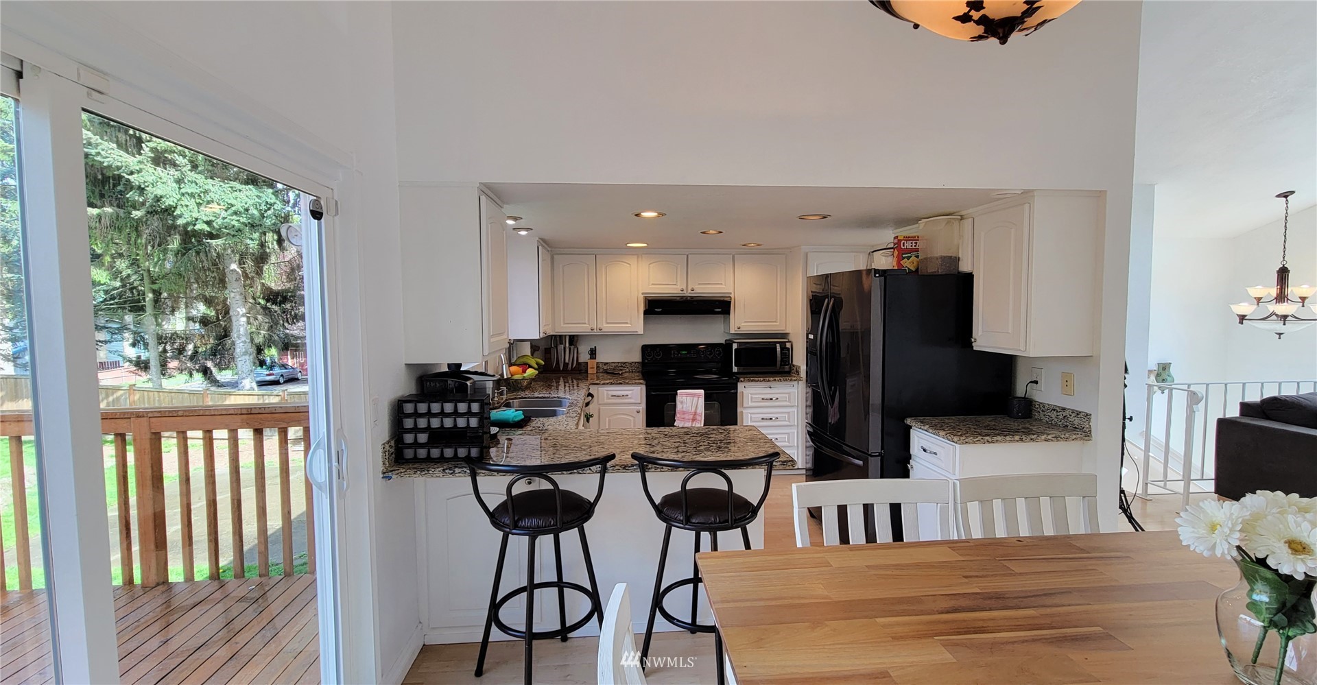 2652 Southwest 333rd Place Federal Way, WA 98023 - Photo 14 of 40 a dining room with furniture and a floor to ceiling window