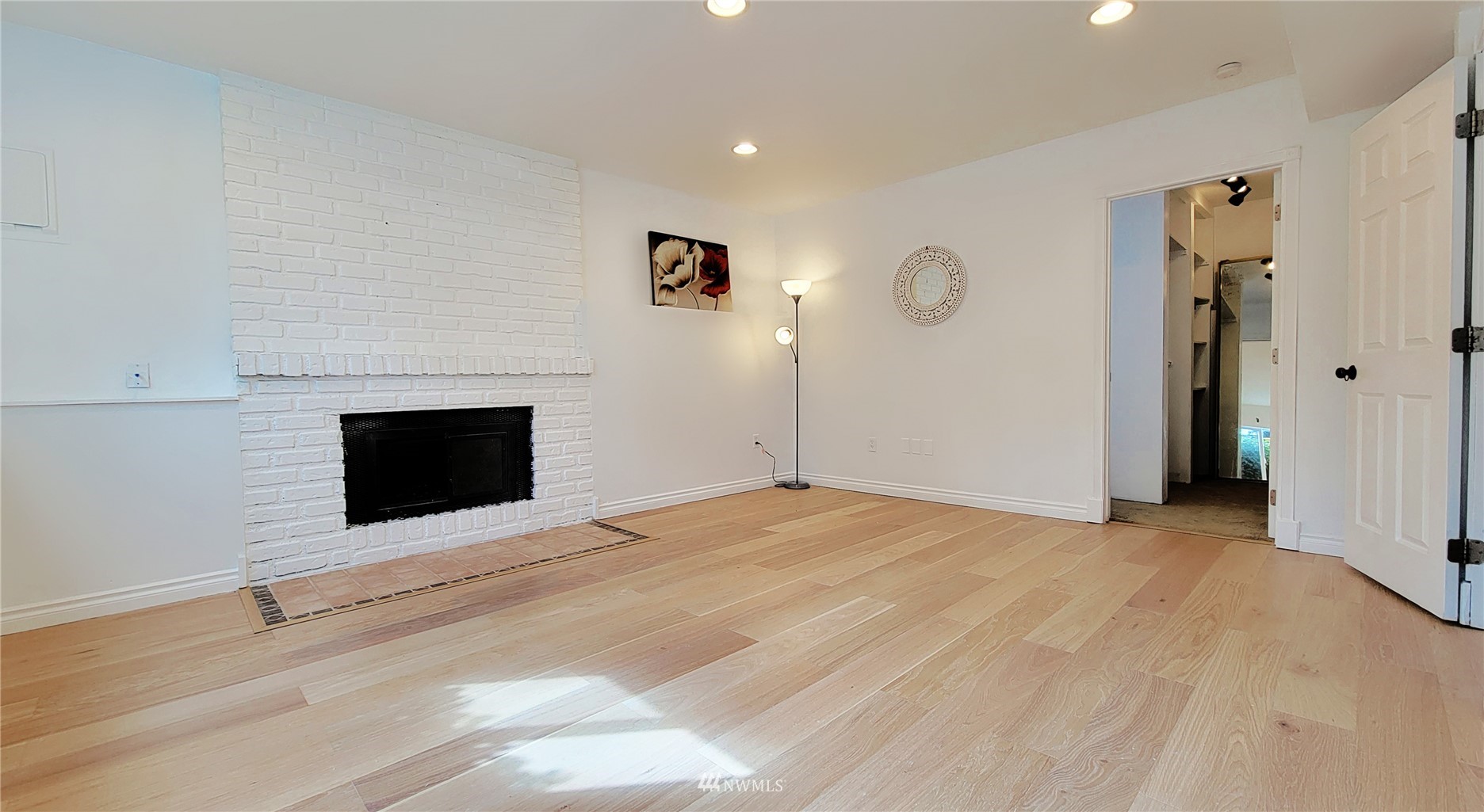 2652 Southwest 333rd Place Federal Way, WA 98023 - Photo 29 of 40 a view of empty room with fireplace and wooden floor