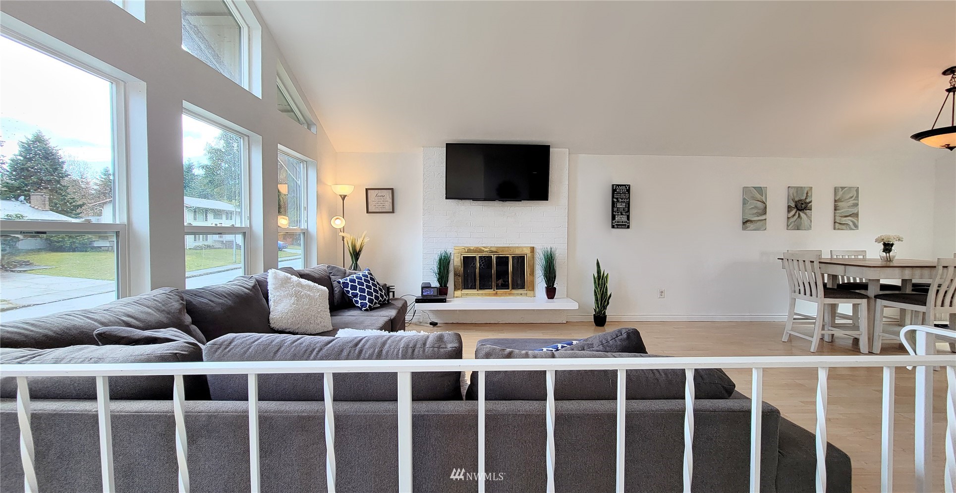 2652 Southwest 333rd Place Federal Way, WA 98023 - Photo 8 of 40 a living room with furniture a flat screen tv and a large window