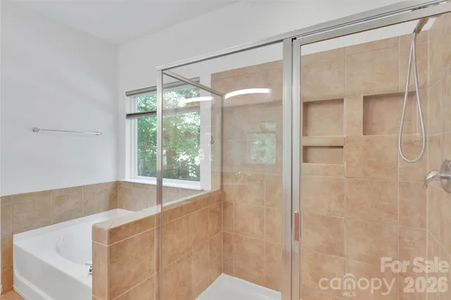 a balcony with furniture and wooden floor