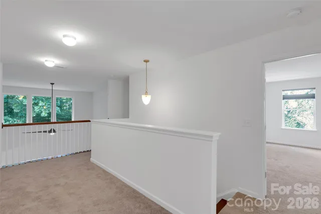 a view of backyard with seating area and green space