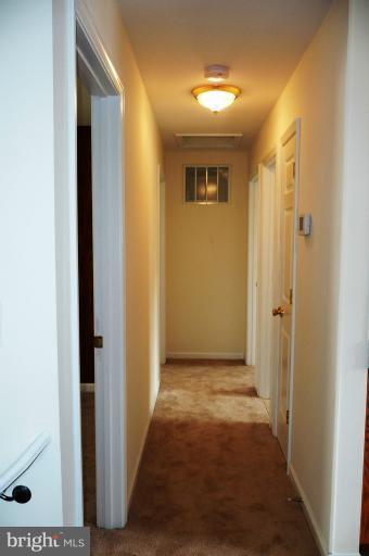 117 Spring Street Gaithersburg, MD 20877 - Photo 5 of 23 a view of a hallway with wooden floor