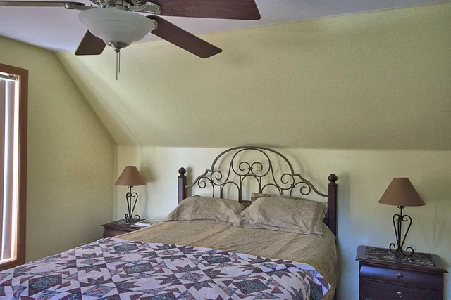 a view of a room with wooden floor and cabinet