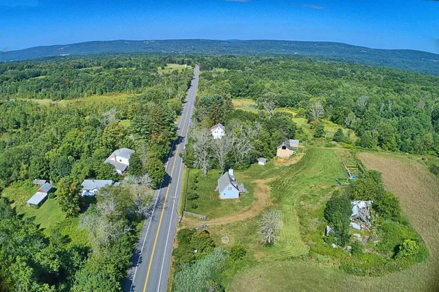a kitchen with stainless steel appliances a refrigerator and a stove top oven