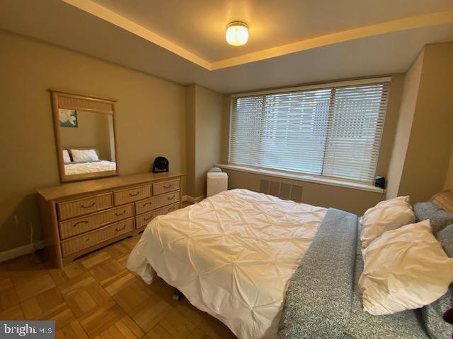 1121 Arlington Boulevard, Unit 620 Arlington, VA 22209 - Photo 2 of 33 a bedroom with a bed and a dresser