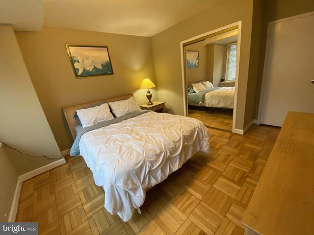 1121 Arlington Boulevard, Unit 620 Arlington, VA 22209 - Photo 3 of 33 a large bed sitting in a bedroom next to a window