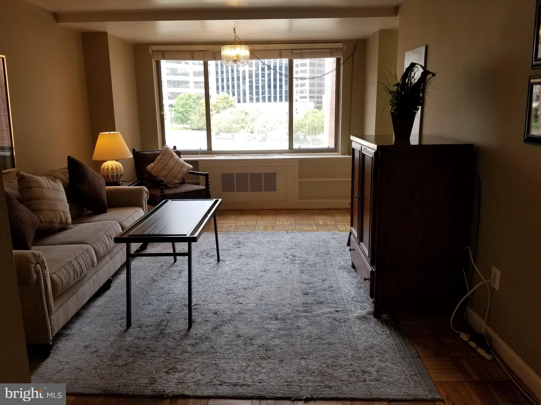 1121 Arlington Boulevard, Unit 620 Arlington, VA 22209 - Photo 6 of 33 a living room with furniture and a window