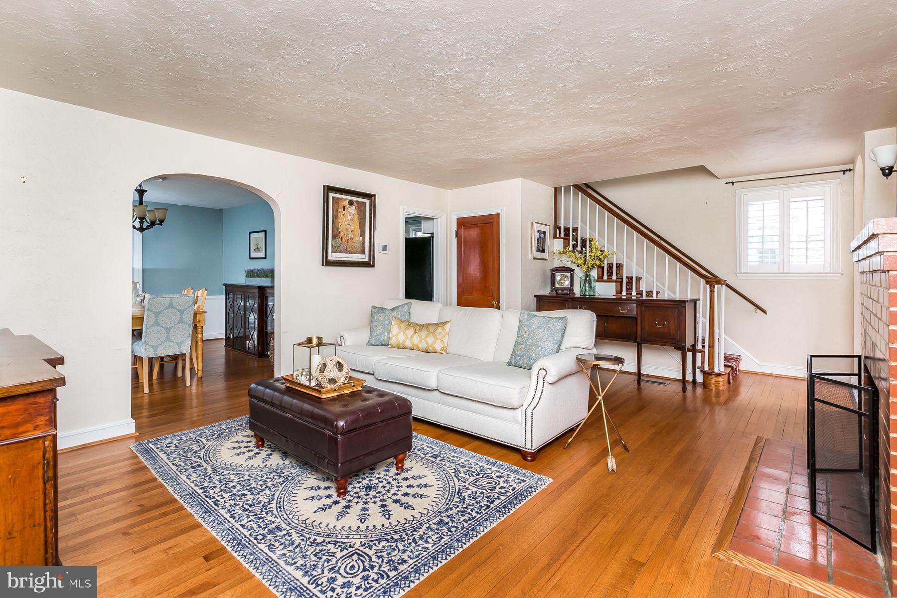 816 Warwick Road Baltimore, MD 21229 - Photo 2 of 44 Family room with fireplace & hardwood floors