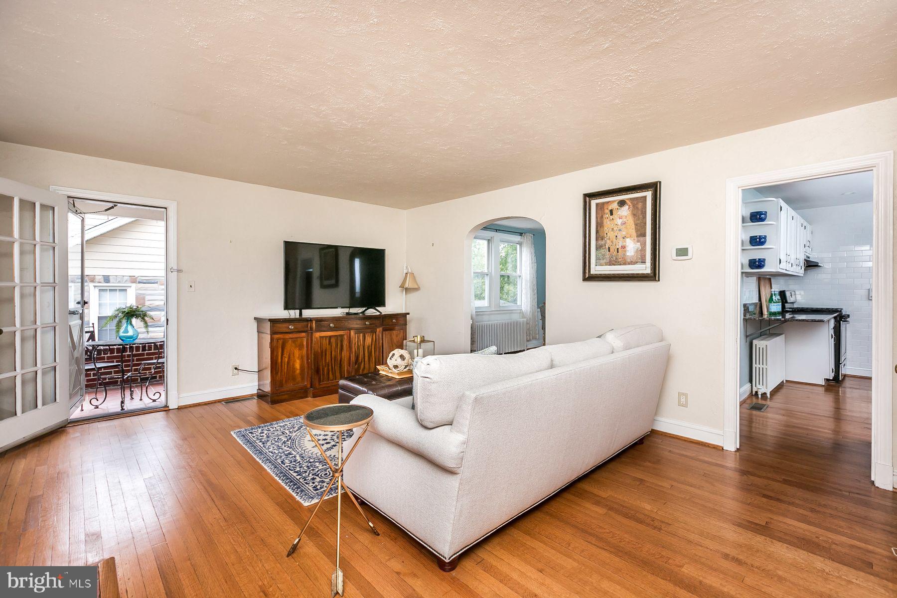816 Warwick Road Baltimore, MD 21229 - Photo 9 of 44 Family room with fireplace & hardwood floors