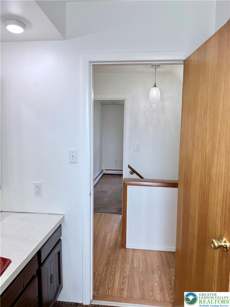5540 Main Street Whitehall, PA 18052 - Photo 25 of 53 A peek inside reveals varied flooring and warm wood accents, hinting at functional spaces.