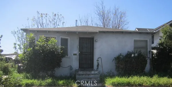 a view of a house with a tree