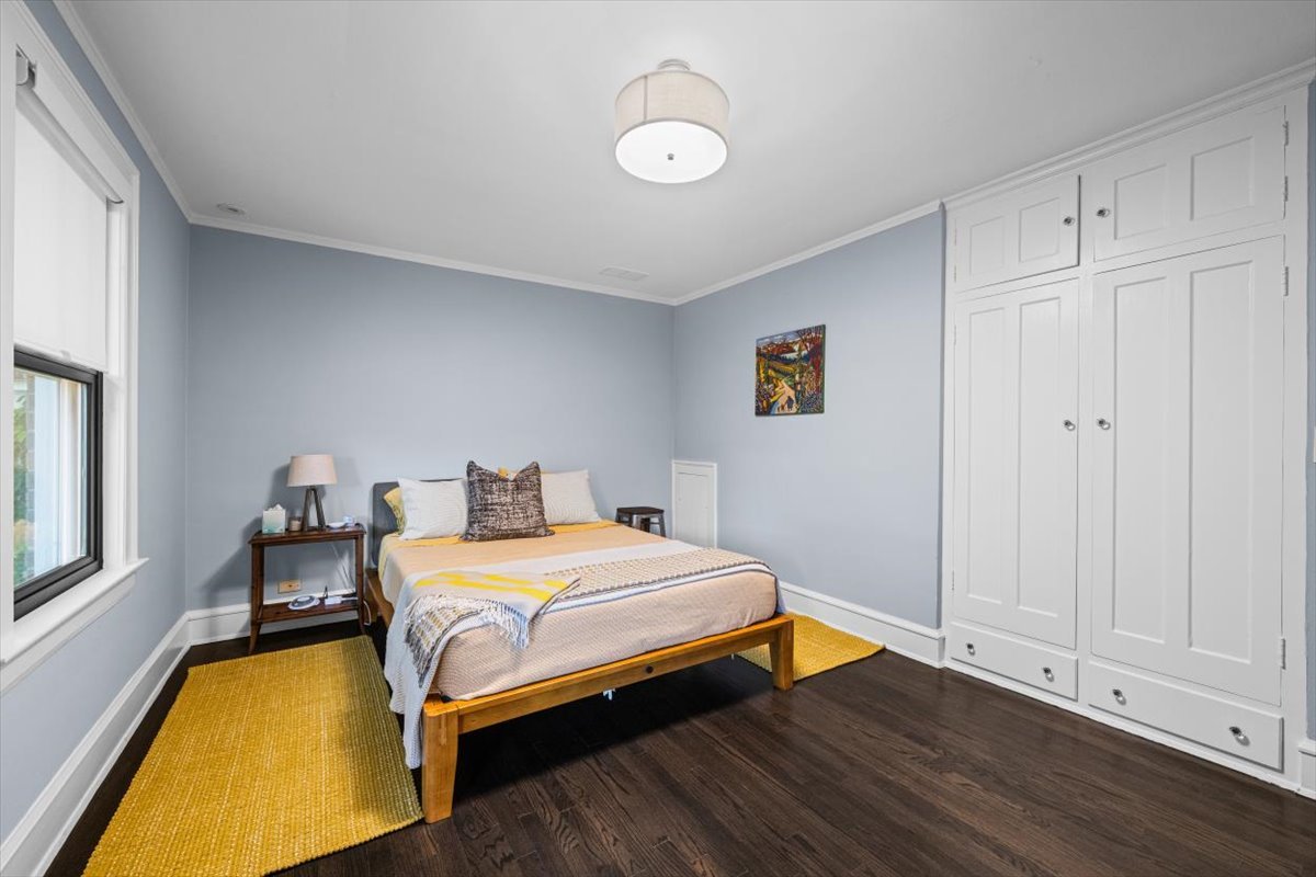 198 Wildwood Road Lake Forest, IL 60045 - Photo 21 of 37 a bedroom with a bed and wooden floor