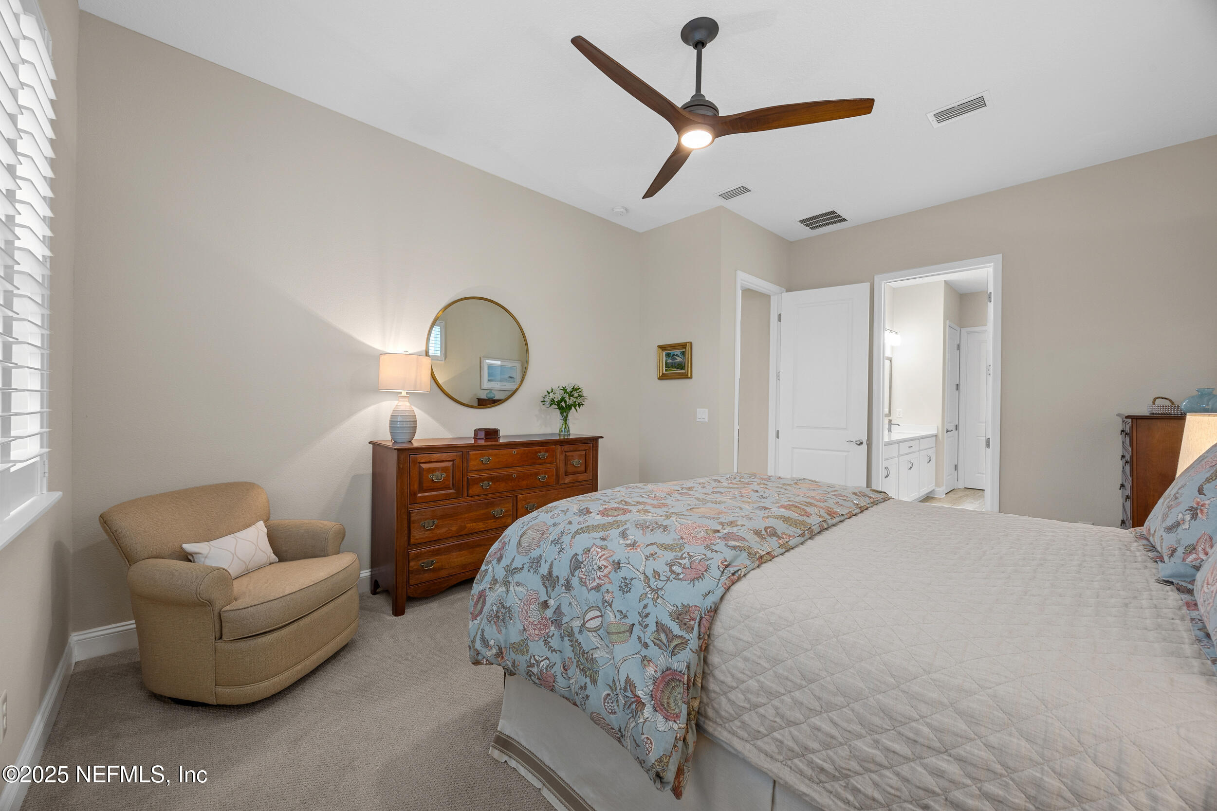 44 Pinellas Way St. Johns, FL 32259 - Photo 18 of 51 a bed room with a bed a couch and a chandelier