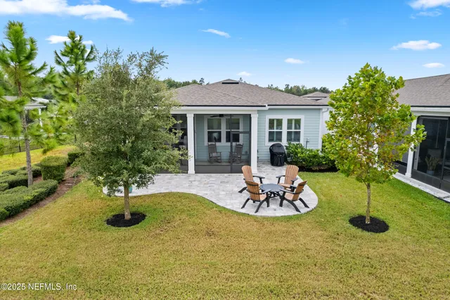 a front view of a house with a garden and patio