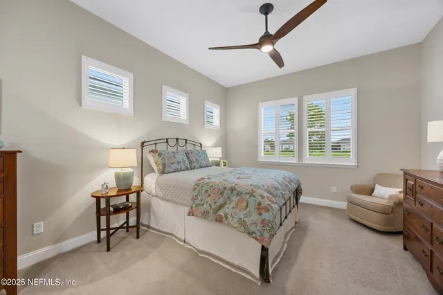 a bedroom with a bed furniture and a window