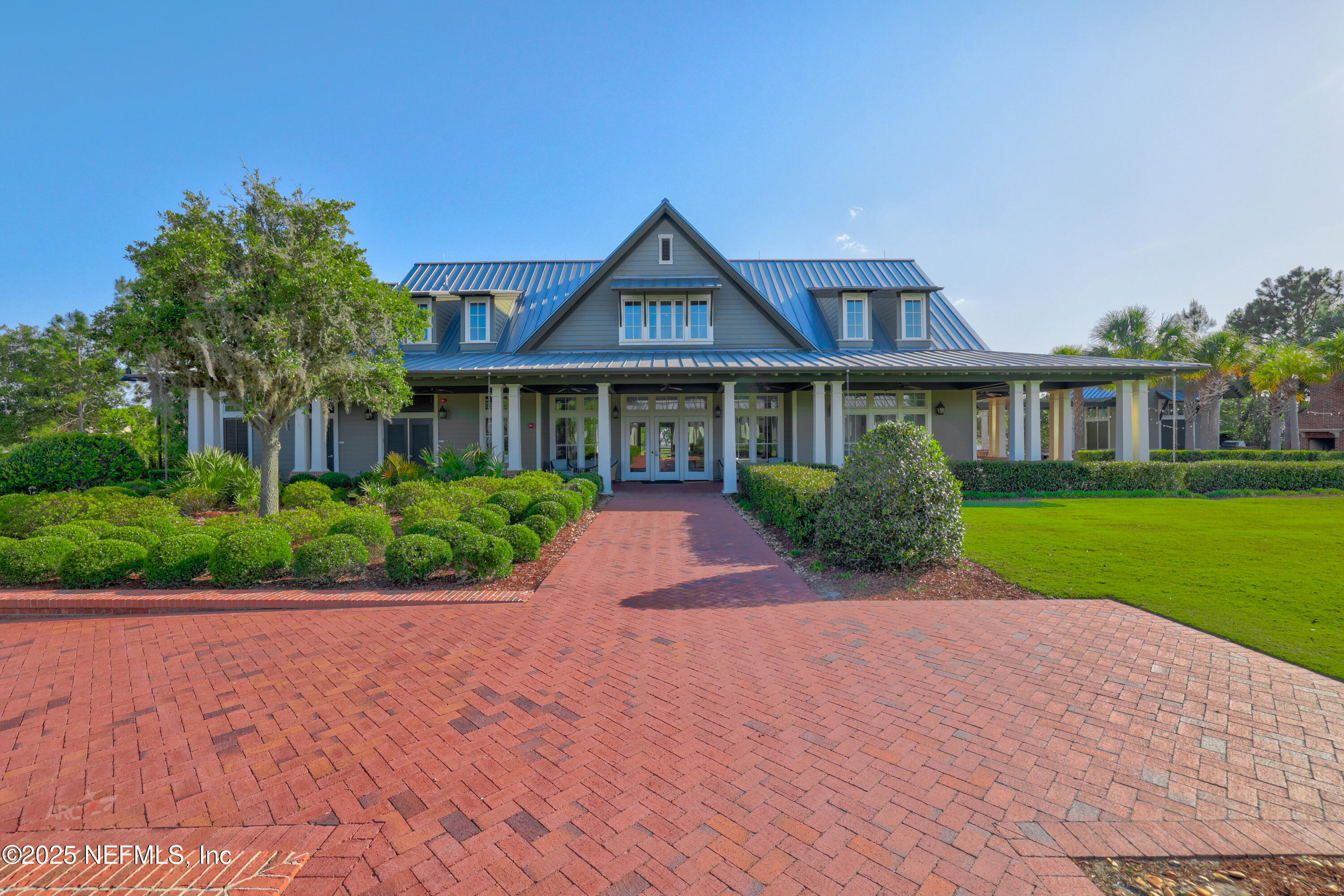 44 Pinellas Way St. Johns, FL 32259 - Photo 44 of 51 a front view of a house with a yard and potted plants
