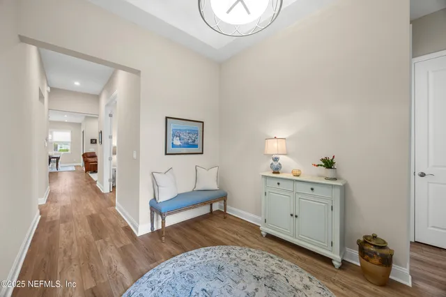 a spacious bedroom with a bed and a table in it