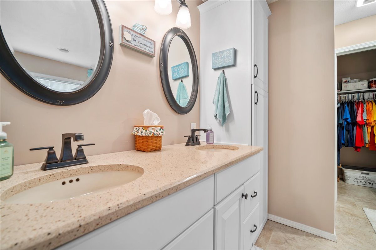 3205 Stonebridge Drive Bloomington, IL 61704 - Photo 15 of 37 a bathroom with a sink and a mirror