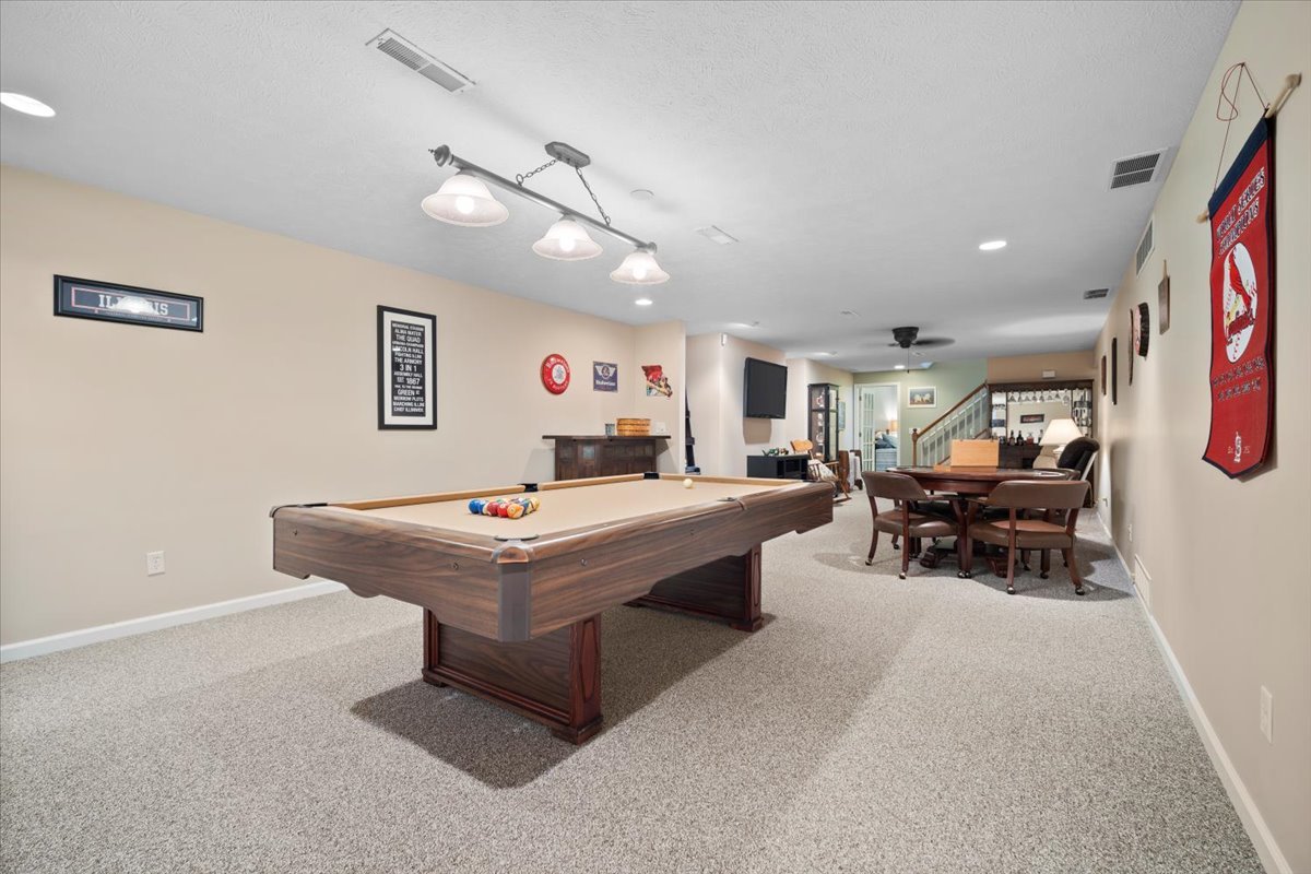 3205 Stonebridge Drive Bloomington, IL 61704 - Photo 25 of 37 a living room with furniture and a table