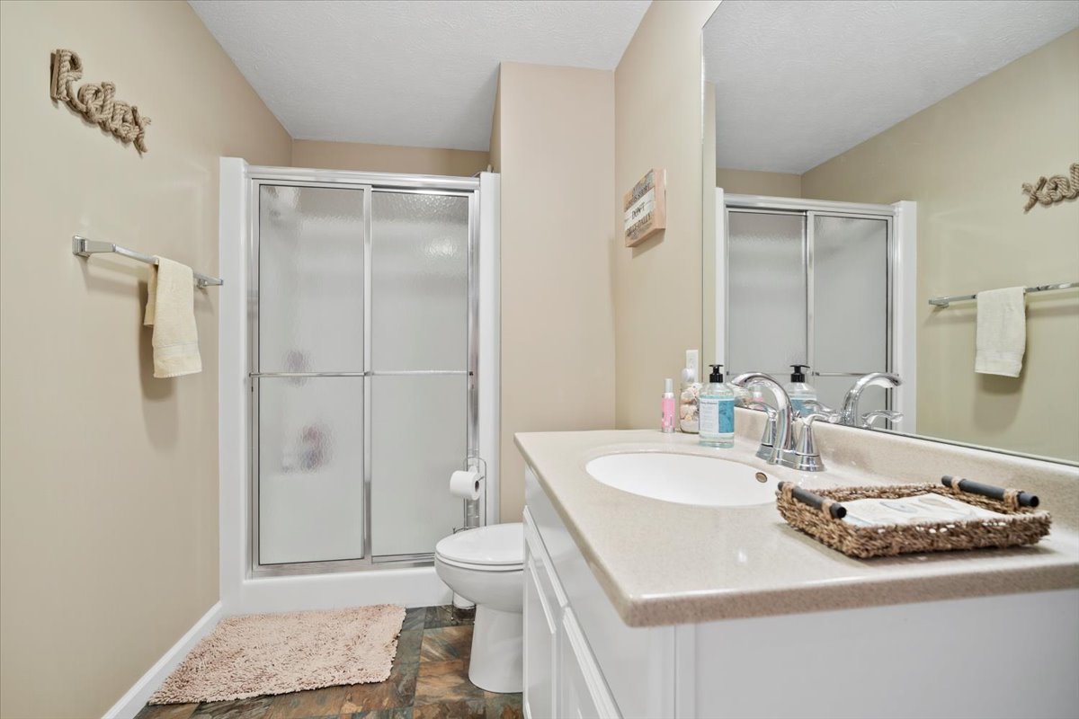 3205 Stonebridge Drive Bloomington, IL 61704 - Photo 27 of 37 a bathroom with a sink toilet and shower