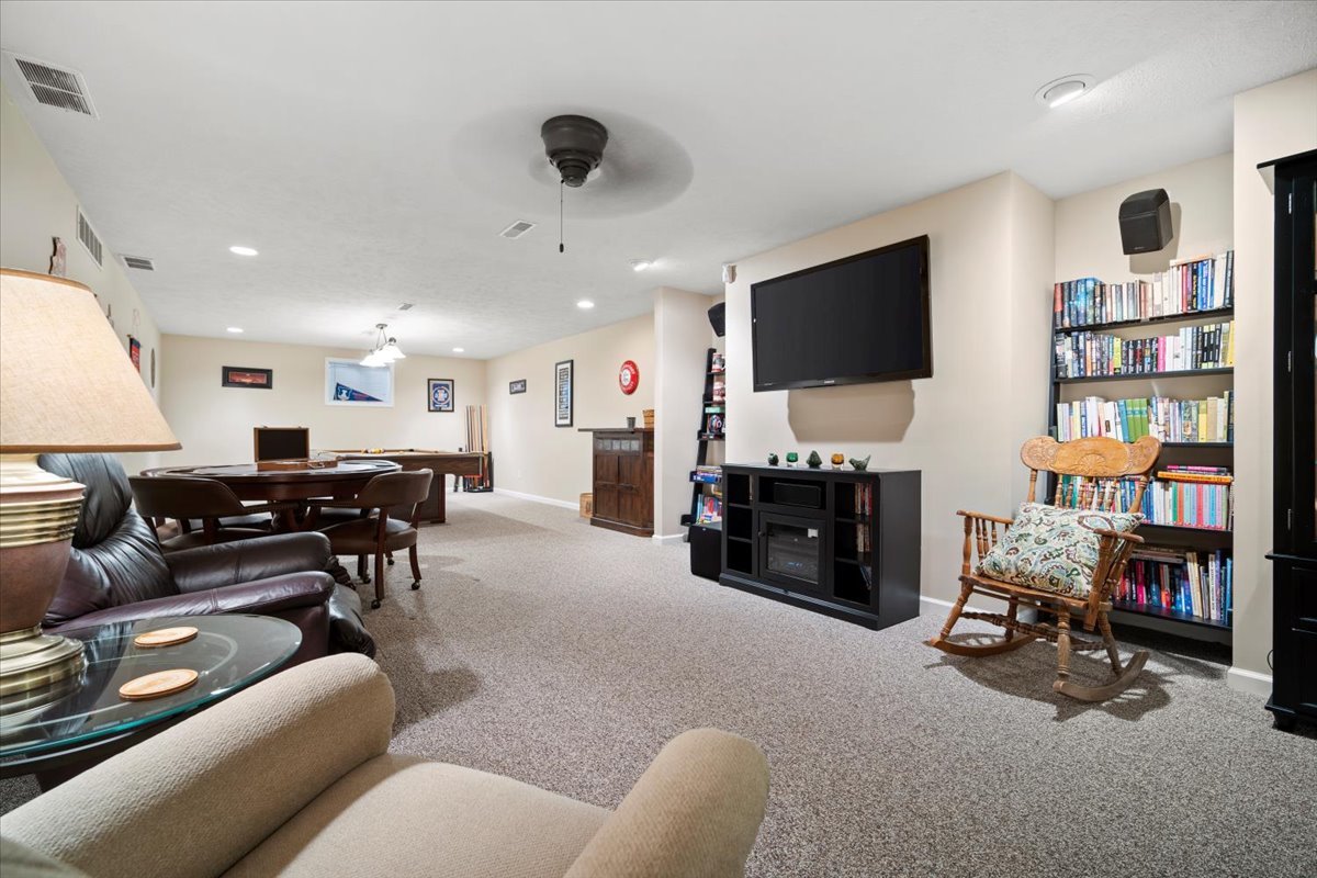 3205 Stonebridge Drive Bloomington, IL 61704 - Photo 30 of 37 a living room with furniture and a flat screen tv