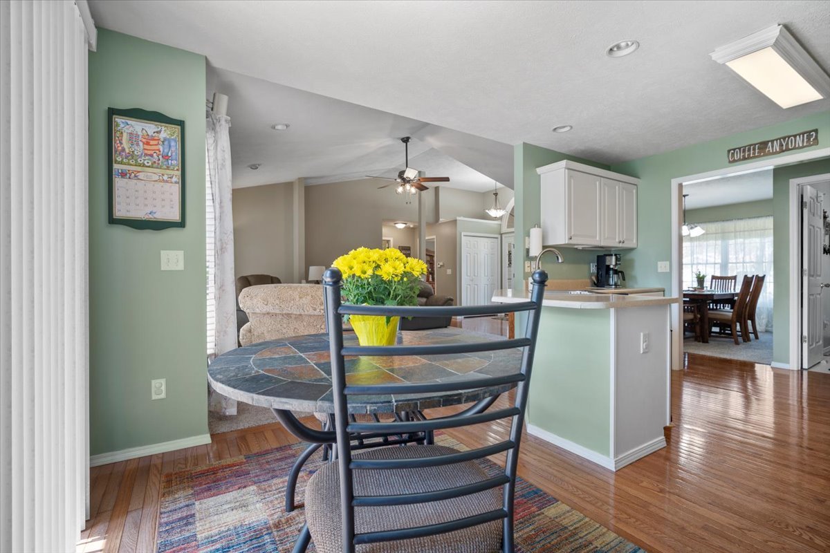 3205 Stonebridge Drive Bloomington, IL 61704 - Photo 9 of 37 a living room with furniture and a chandelier