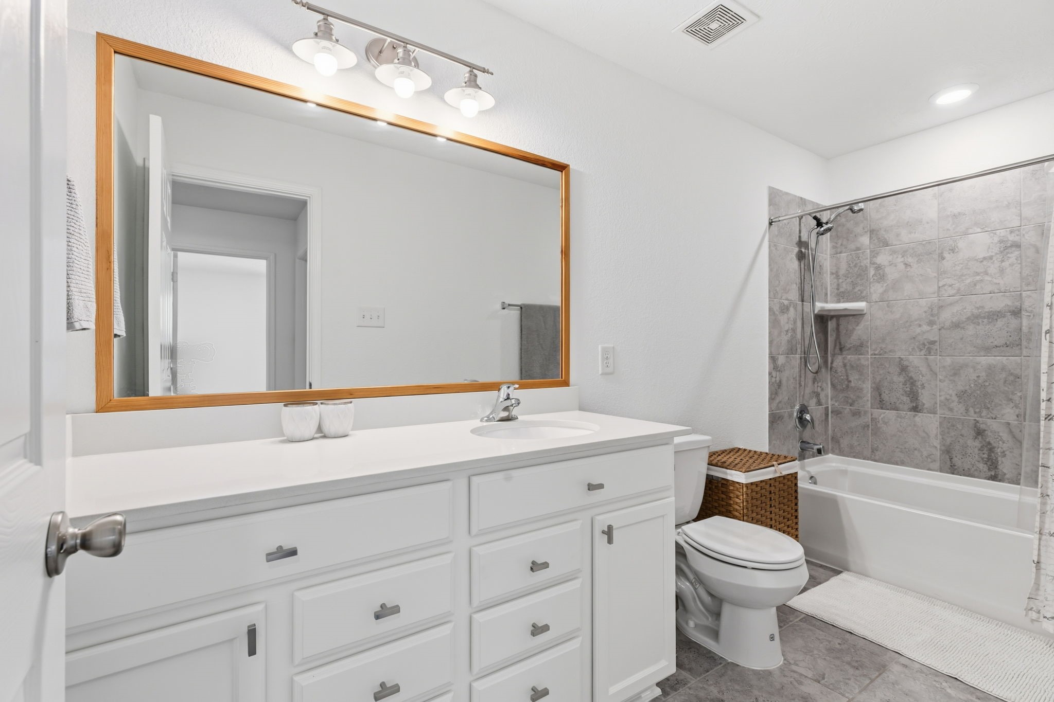 5127 Avondale Rise Street Katy, TX 77493 - Photo 36 of 47 a bathroom with a toilet a sink a mirror a bathtub and vanity