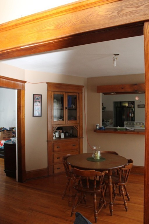 18-20 Howes Street Springfield, MA 01118 - Photo 14 of 30 a view of a dining room with furniture and wooden floor