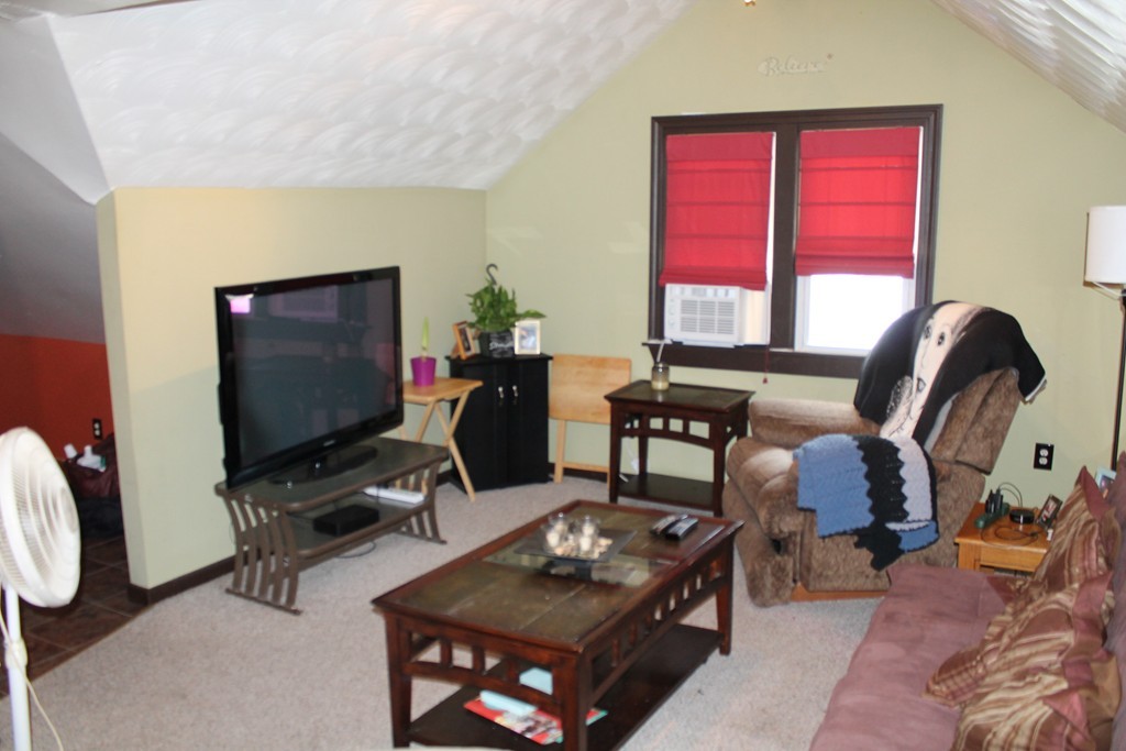 18-20 Howes Street Springfield, MA 01118 - Photo 20 of 30 a living room with furniture a window and a flat screen tv