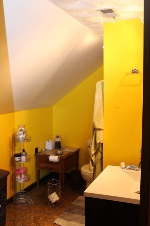18-20 Howes Street Springfield, MA 01118 - Photo 24 of 30 a view of a bathroom with a sink and a mirror